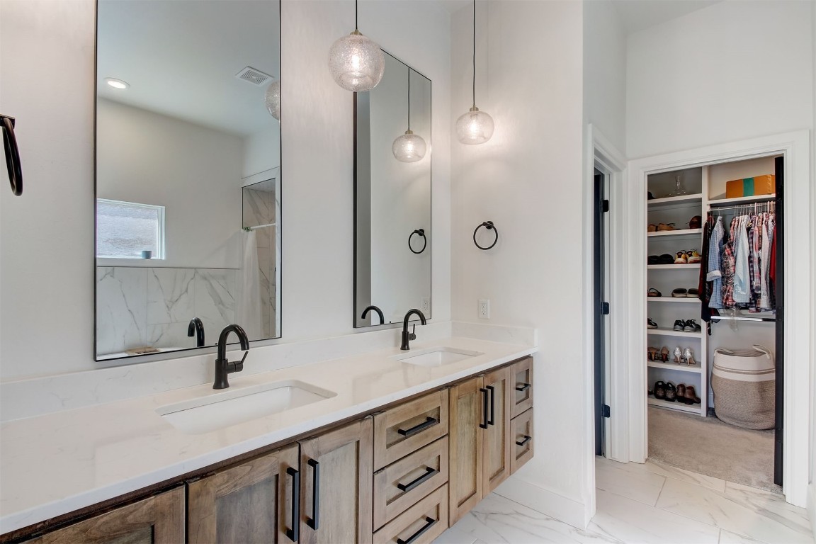 9224 NW 82nd Street, Yukon, OK 73099 bathroom with dual vanity and tile flooring