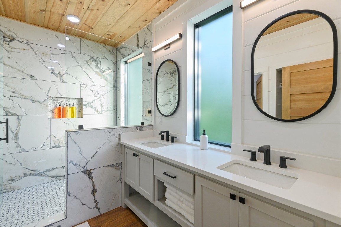 262 Forest Brook Loop, Broken Bow, OK 74728 bathroom featuring hardwood / wood-style flooring, dual bowl vanity, and wood ceiling