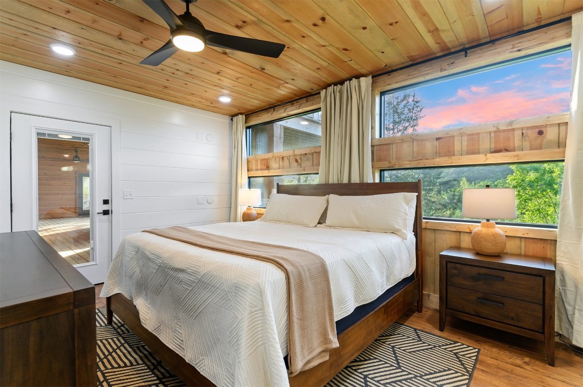 262 Forest Brook Loop, Broken Bow, OK 74728 bedroom featuring wooden ceiling, ceiling fan, and hardwood / wood-style flooring