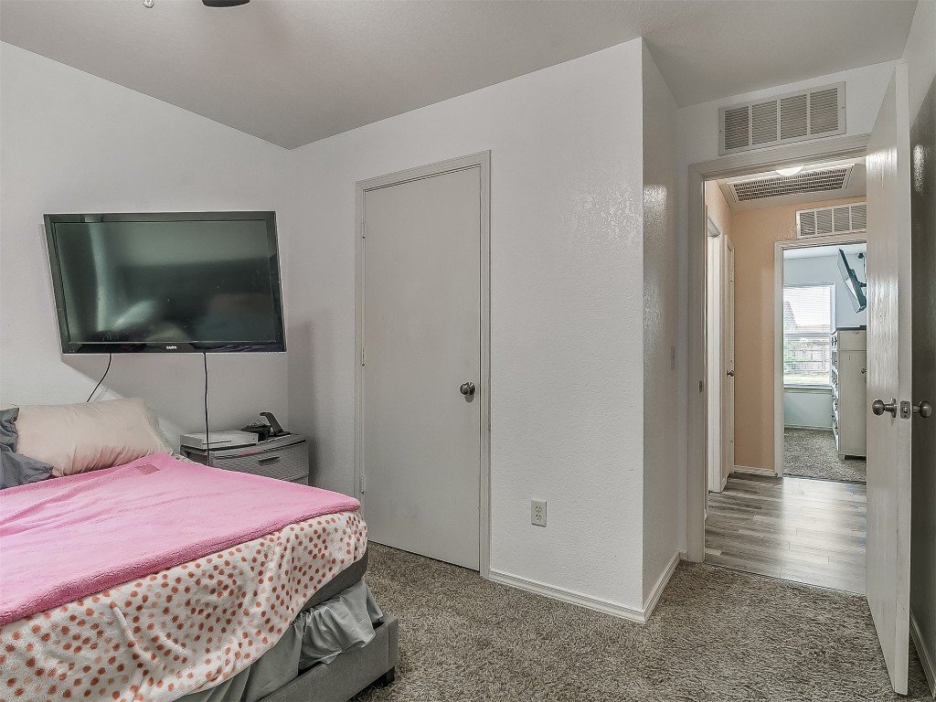 15509 Ivy Hill Drive, Oklahoma City, OK 73170 bedroom featuring dark wood-type flooring