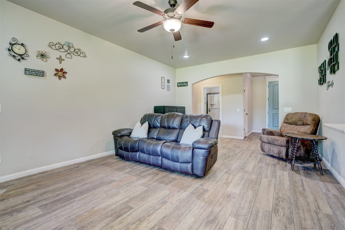 551 Canyon Creek Lane, Guthrie, OK 73044 living room featuring ceiling fan and hardwood / wood-style flooring