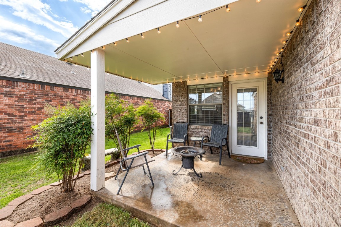 1007 SW 23rd Street, Moore, OK 73170 view of patio / terrace featuring an outdoor fire pit