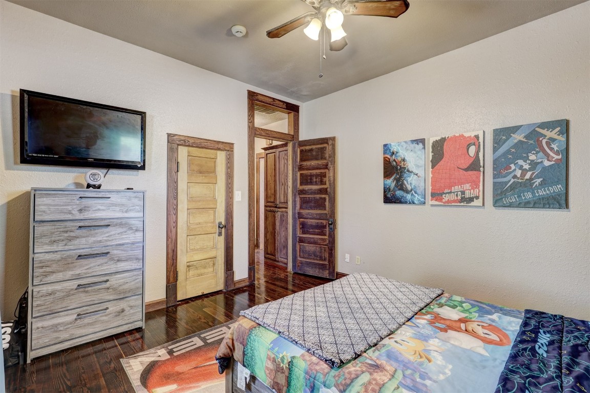 1008 Sunset Drive, El Reno, OK 73036 bedroom featuring dark hardwood / wood-style flooring and ceiling fan