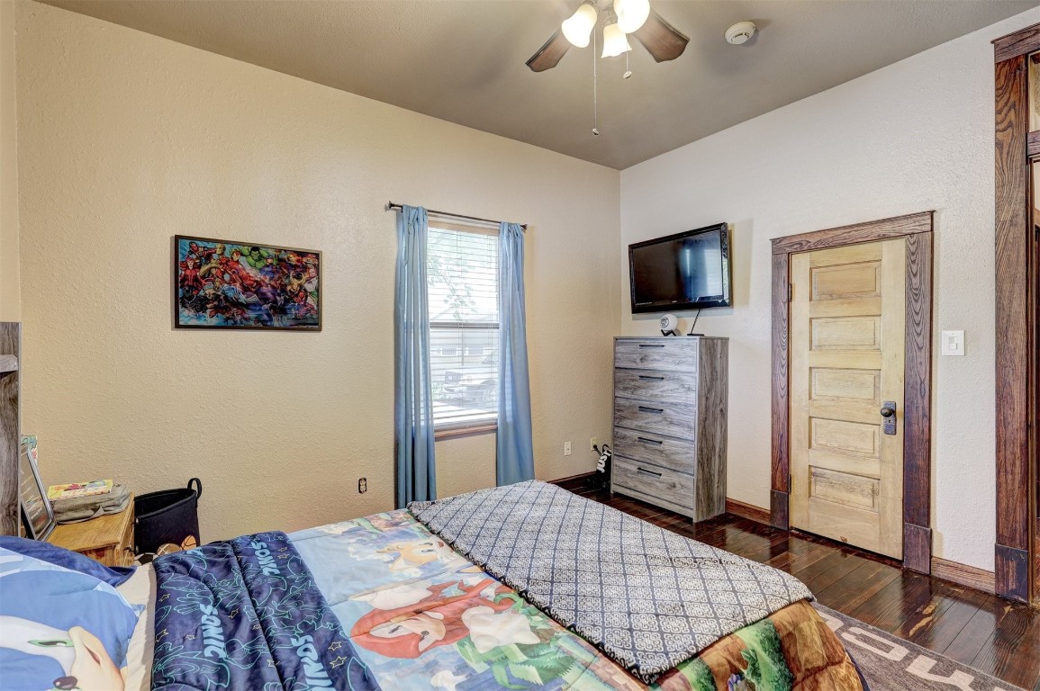 1008 Sunset Drive, El Reno, OK 73036 bedroom featuring ceiling fan and dark hardwood / wood-style floors