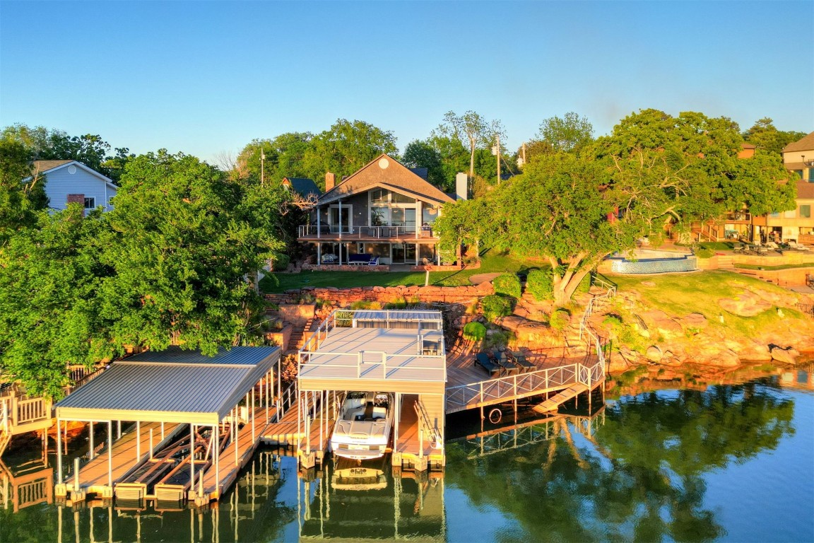 103 E Shore Drive, Arcadia, OK 73007 dock area featuring a balcony and a deck with water view