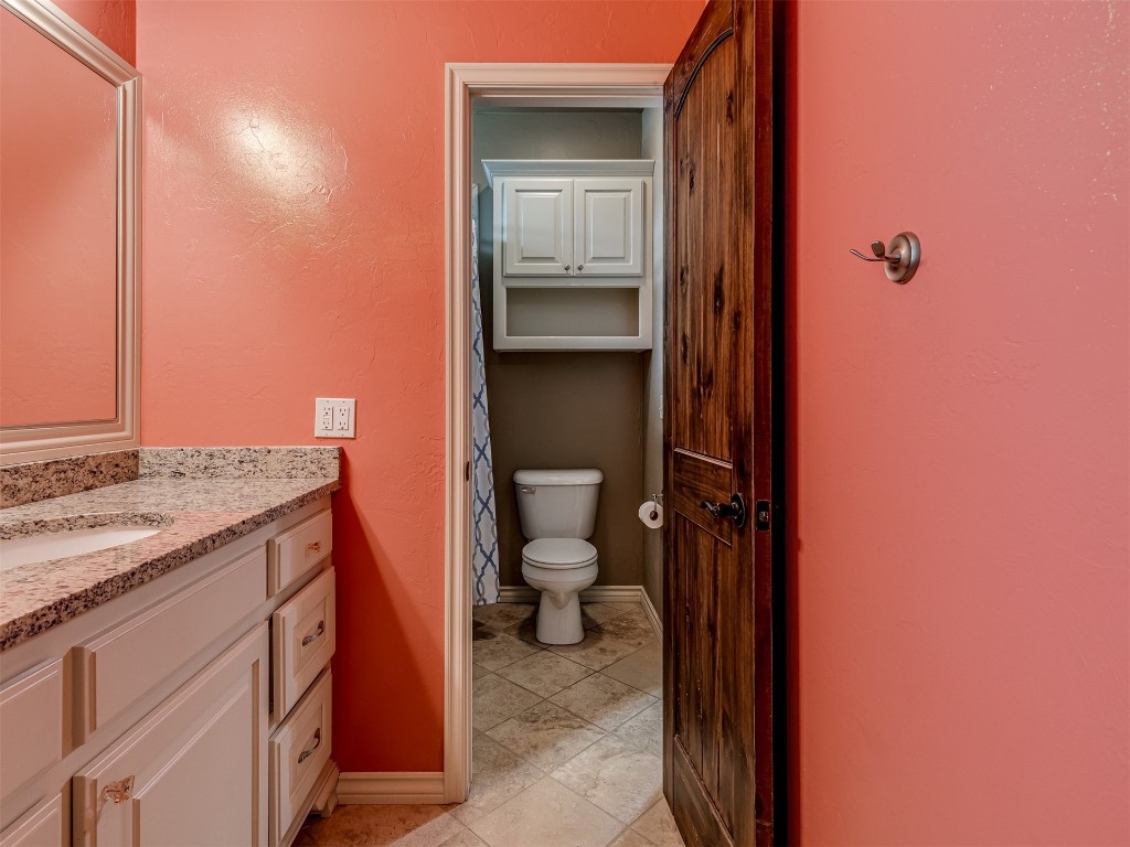 9612 SW 35th Street, Oklahoma City, OK 73179 bathroom with vanity, tile floors, and toilet
