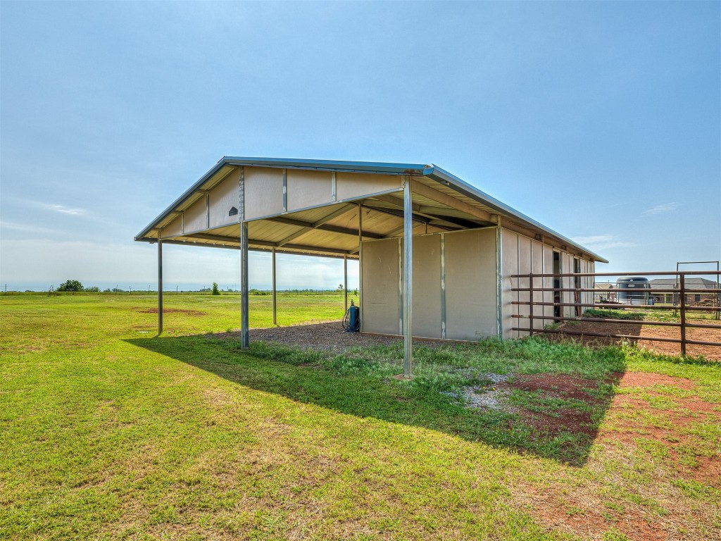 3952 NE Arrowhead Road, Piedmont, OK 73078 view of outdoor structure featuring a lawn