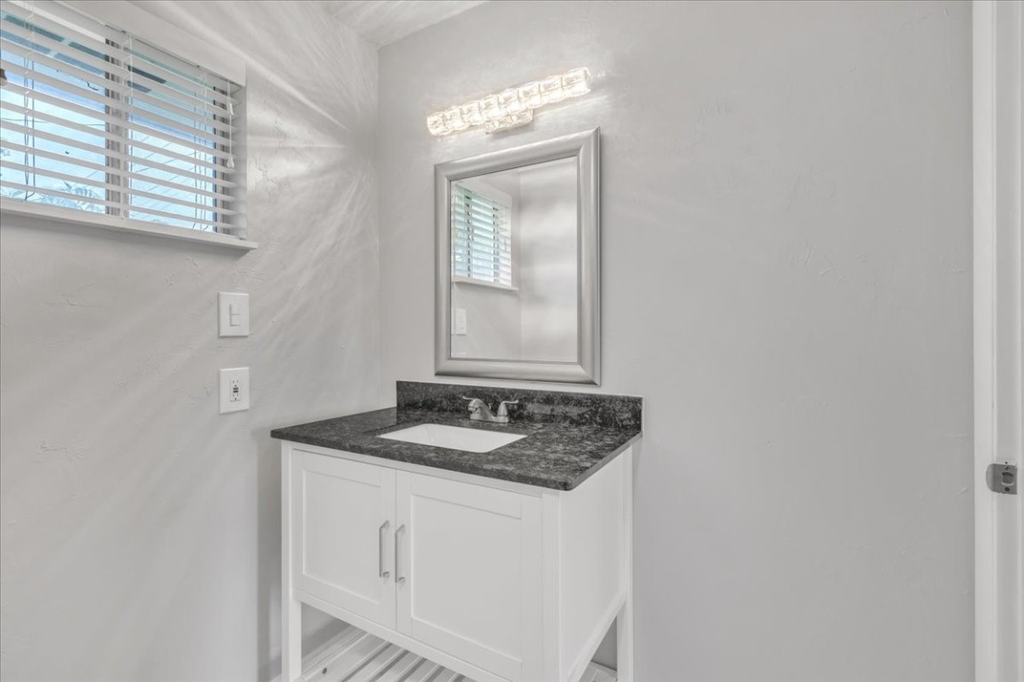 5712 N Roff Avenue, Oklahoma City, OK 73112 bathroom featuring oversized vanity and plenty of natural light