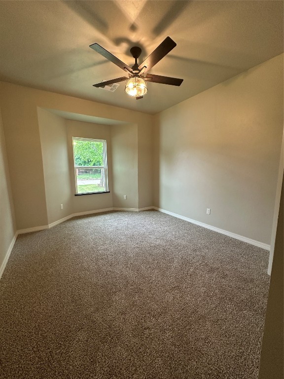 3209 N Pioneer Street, Oklahoma City, OK 73107 carpeted spare room featuring ceiling fan