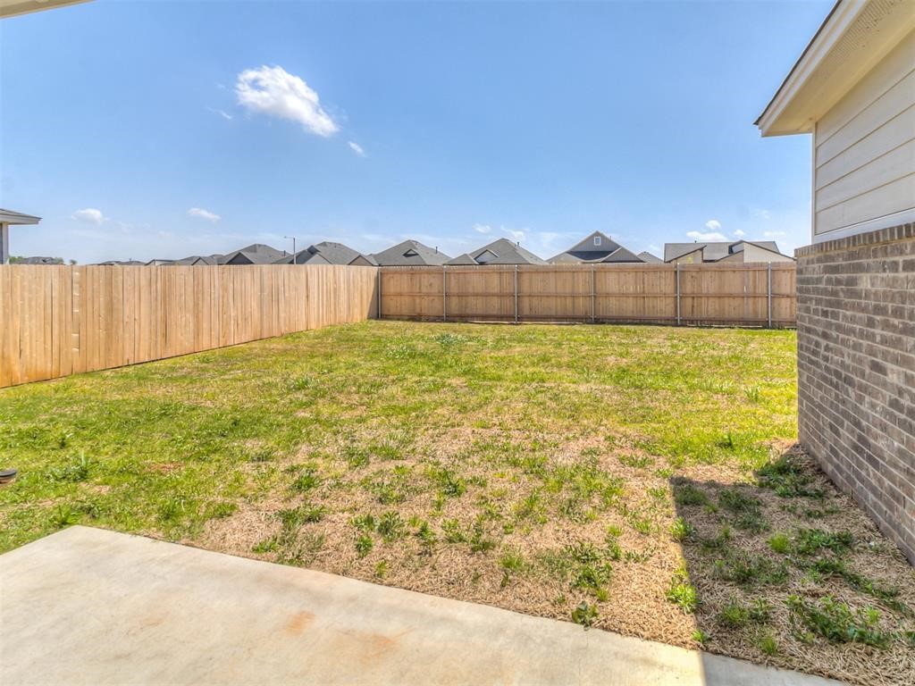 8112 NW 153rd Street, Edmond, OK 73013 view of yard featuring a patio area