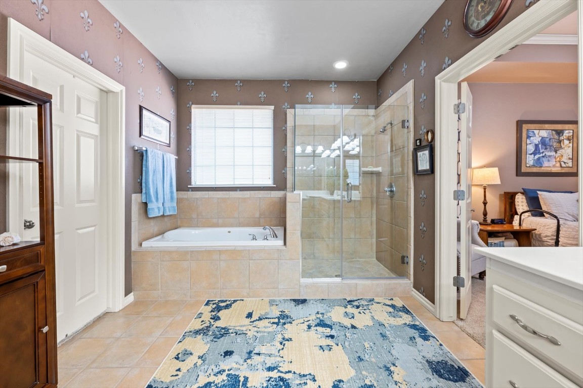 1816 Redland Drive, Edmond, OK 73003 bathroom featuring vanity, tile floors, and independent shower and bath