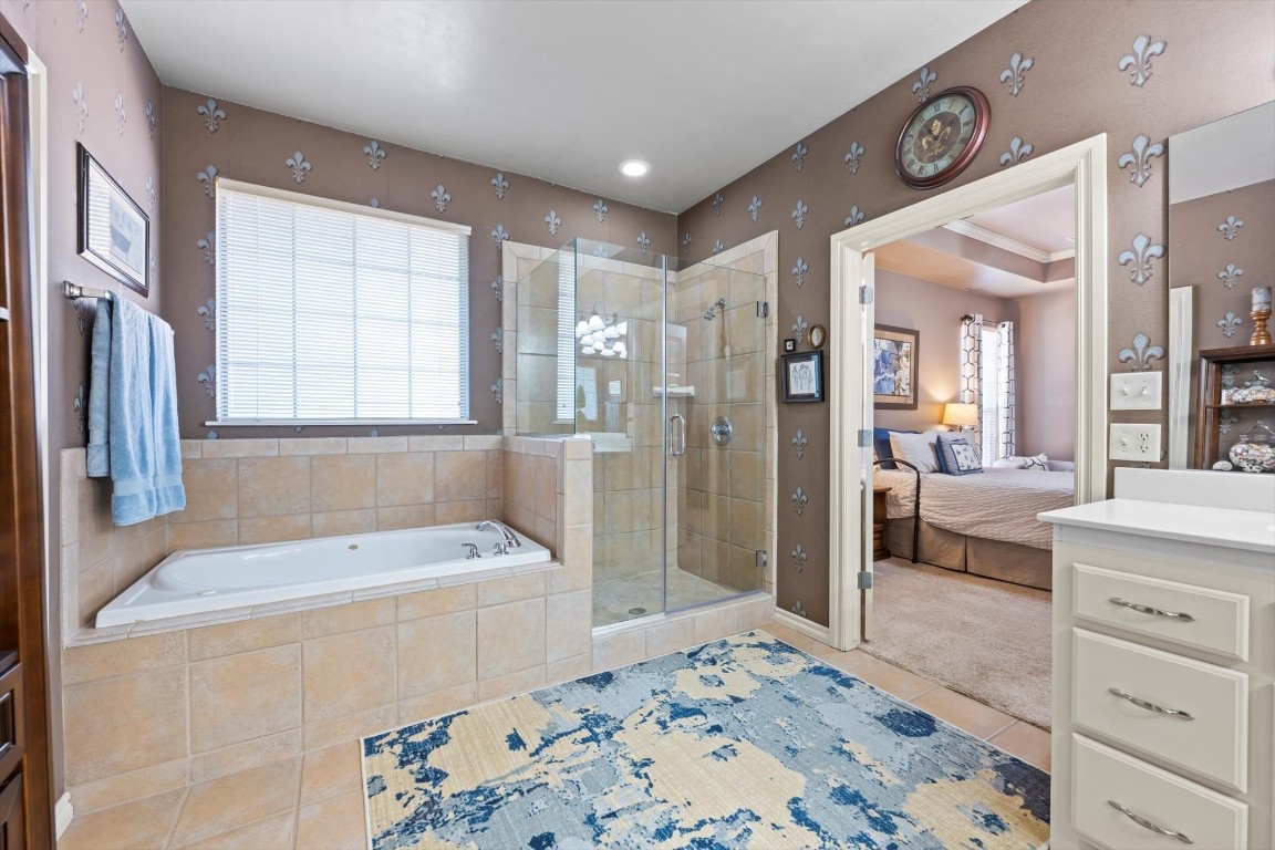 1816 Redland Drive, Edmond, OK 73003 bathroom with vanity, tile floors, and separate shower and tub