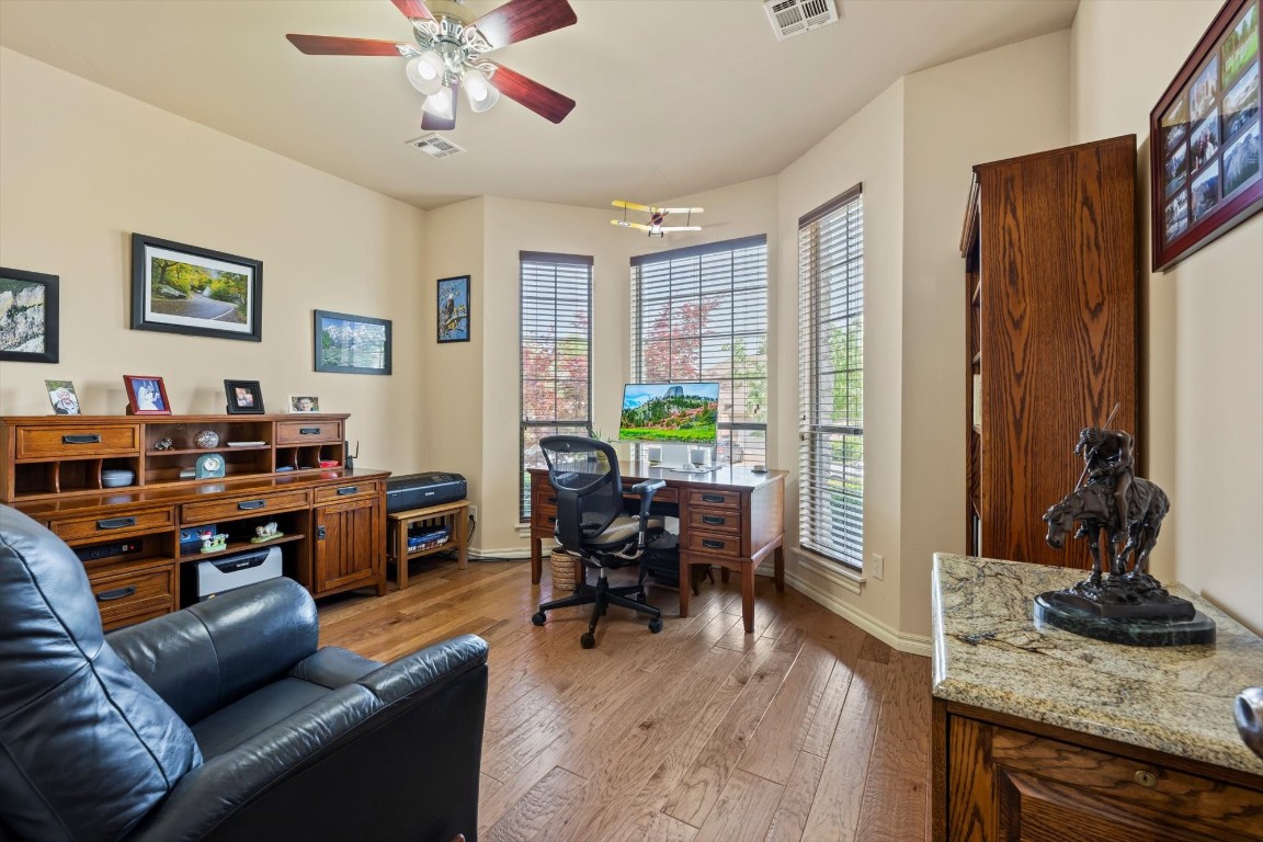 1816 Redland Drive, Edmond, OK 73003 office space featuring wood-type flooring and ceiling fan