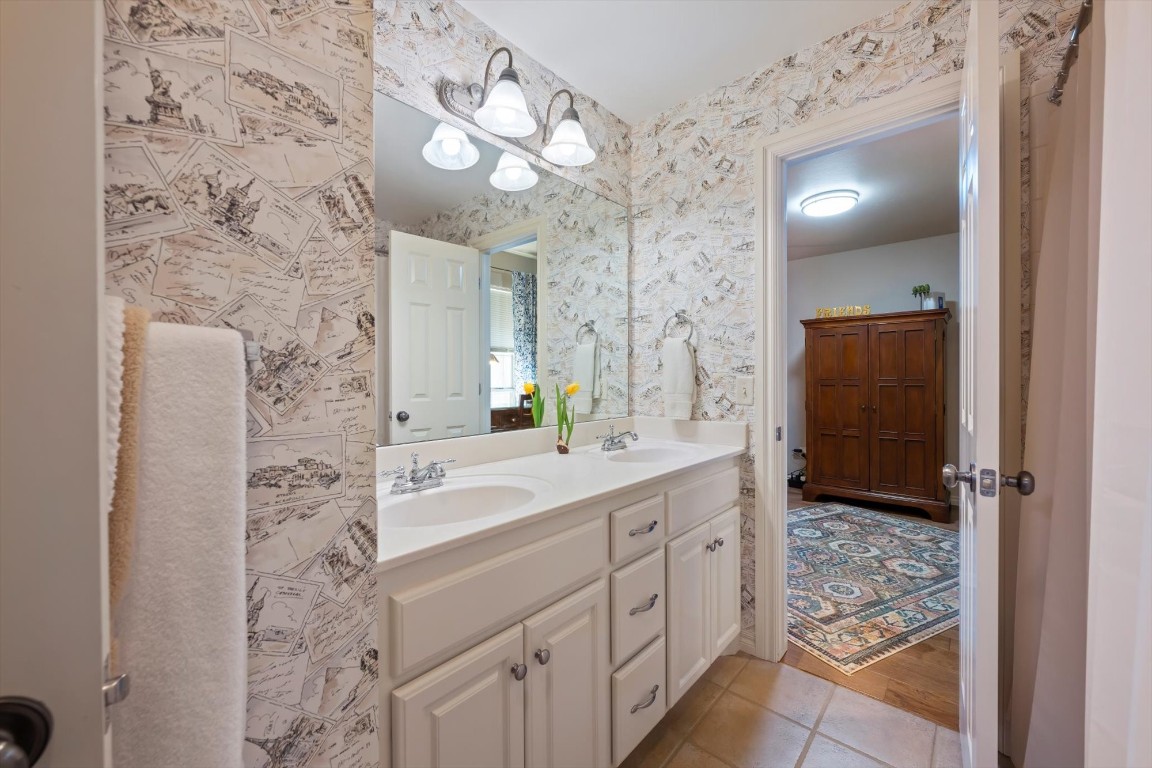 1816 Redland Drive, Edmond, OK 73003 bathroom featuring dual vanity and tile floors