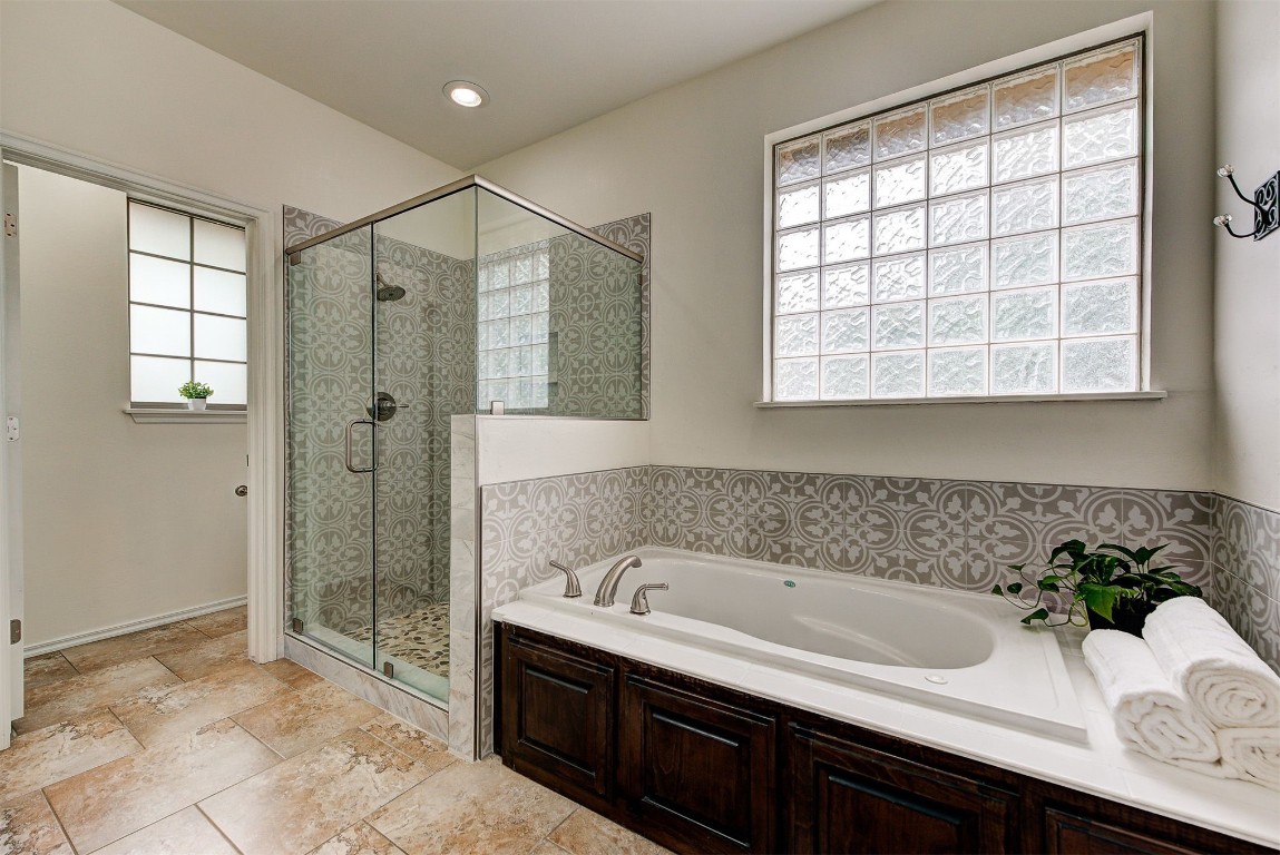 820 White Tail Court, Guthrie, OK 73044 bathroom featuring tile floors and separate shower and tub