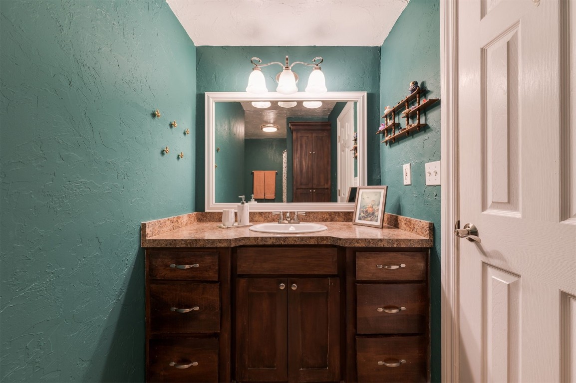 2825 NW 11th Street, Oklahoma City, OK 73107 bathroom with tile flooring, toilet, and a textured ceiling