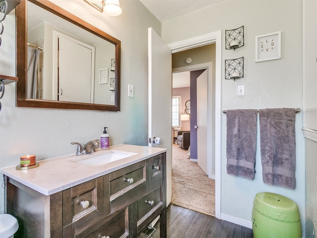 2403 Oxford Way, Oklahoma City, OK 73120 bathroom with hardwood / wood-style floors and large vanity