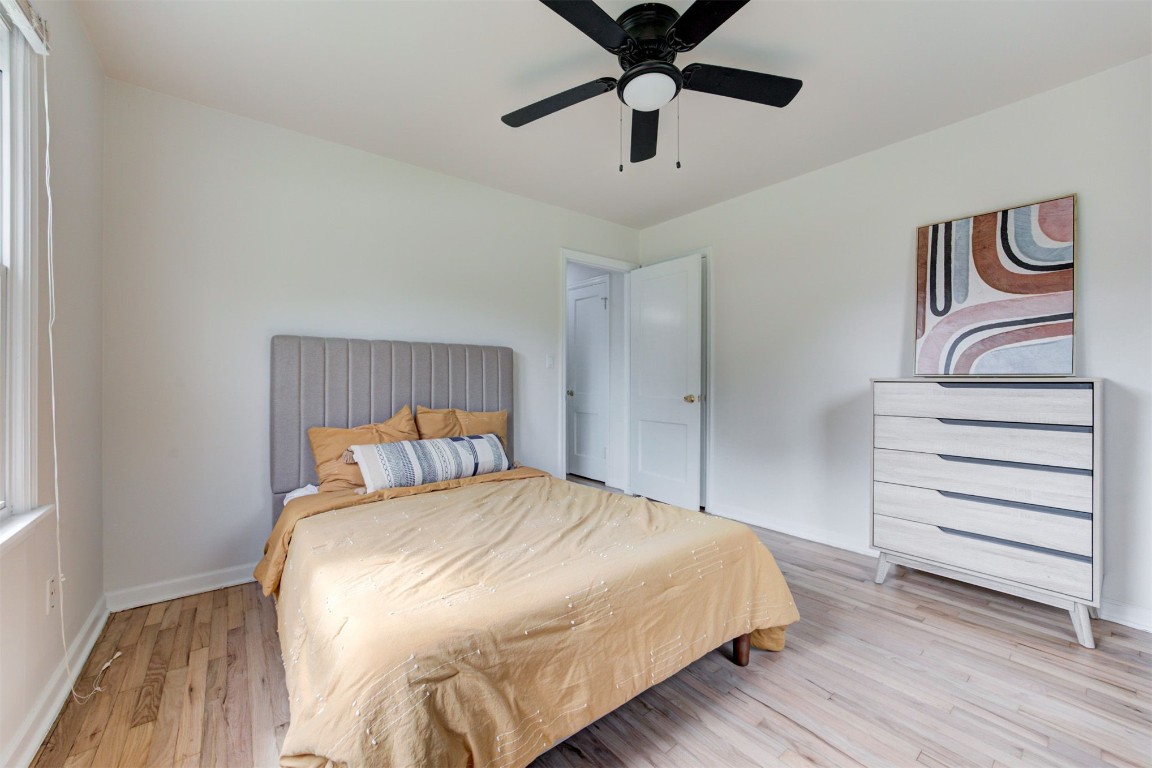 901 Iowa Street, Norman, OK 73069 bedroom with light hardwood / wood-style floors and ceiling fan