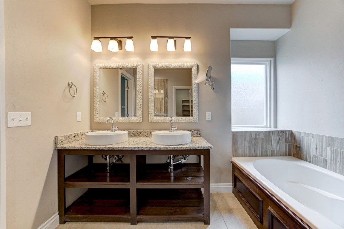 10508 Glover River Drive, Yukon, OK 73099 bathroom with tile floors and dual vanity