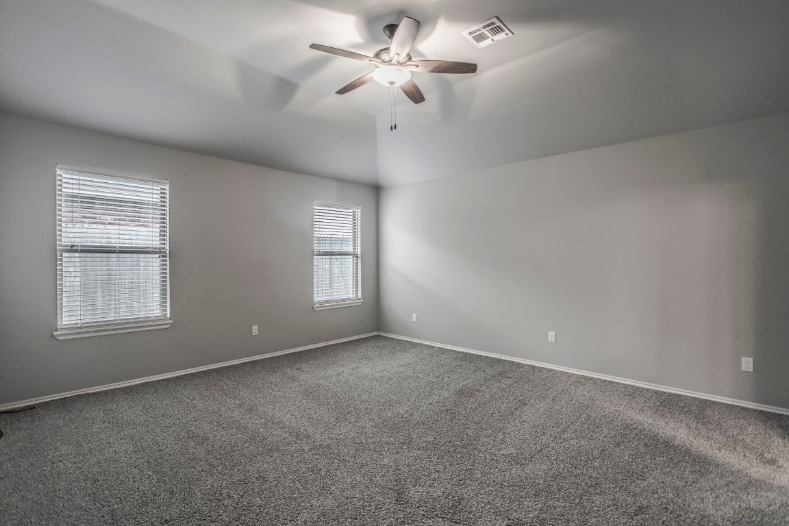 4604 Oasis Lane, Yukon, OK 73099 carpeted spare room featuring ceiling fan