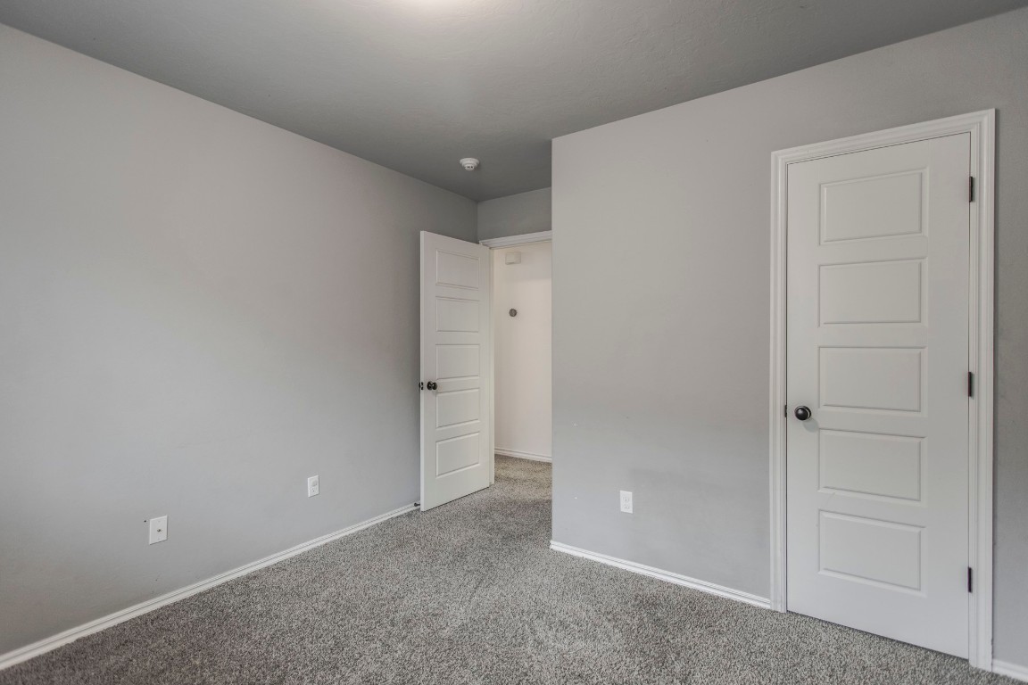 4604 Oasis Lane, Yukon, OK 73099 unfurnished bedroom featuring carpet