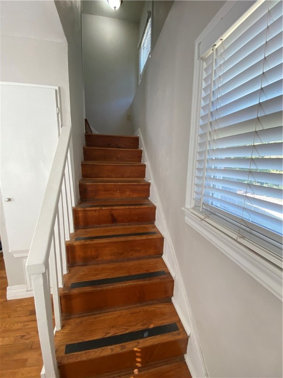 712 S Littler Avenue, Edmond, OK 73034 staircase featuring hardwood / wood-style flooring