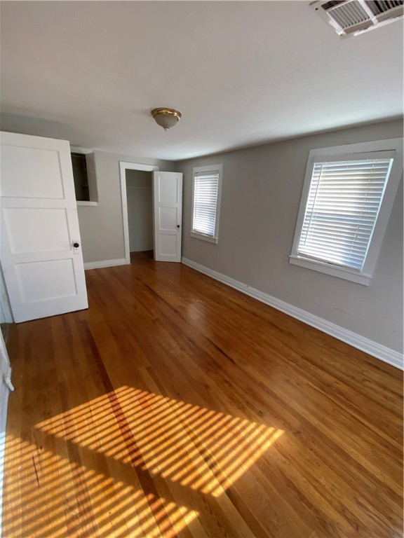 712 S Littler Avenue, Edmond, OK 73034 spare room featuring hardwood / wood-style floors