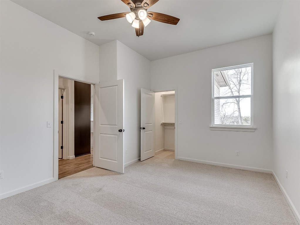 8007 Goldfinch Drive, Guthrie, OK 73044 spare room with carpet flooring and ceiling fan