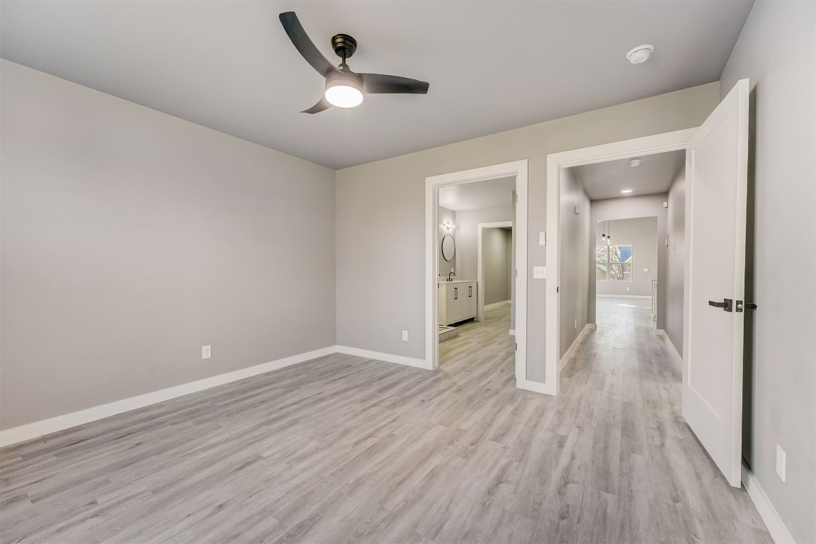 1721 N Jordan Avenue, Oklahoma City, OK 73111 unfurnished bedroom with light hardwood / wood-style flooring and ceiling fan