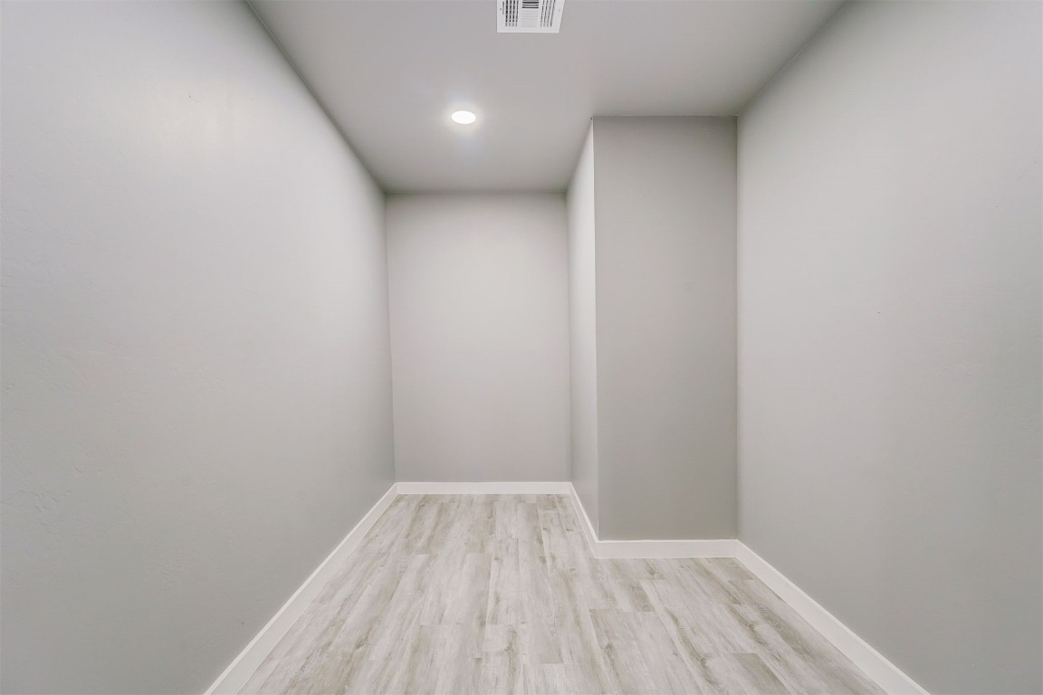 1721 N Jordan Avenue, Oklahoma City, OK 73111 spare room featuring light wood-type flooring