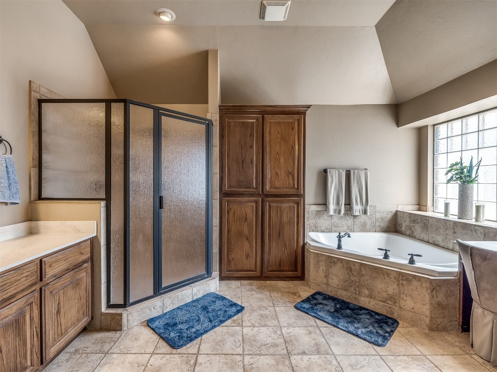 10621 Sundance Avenue, Yukon, OK 73099 bathroom with shower with separate bathtub, vanity, and tile flooring