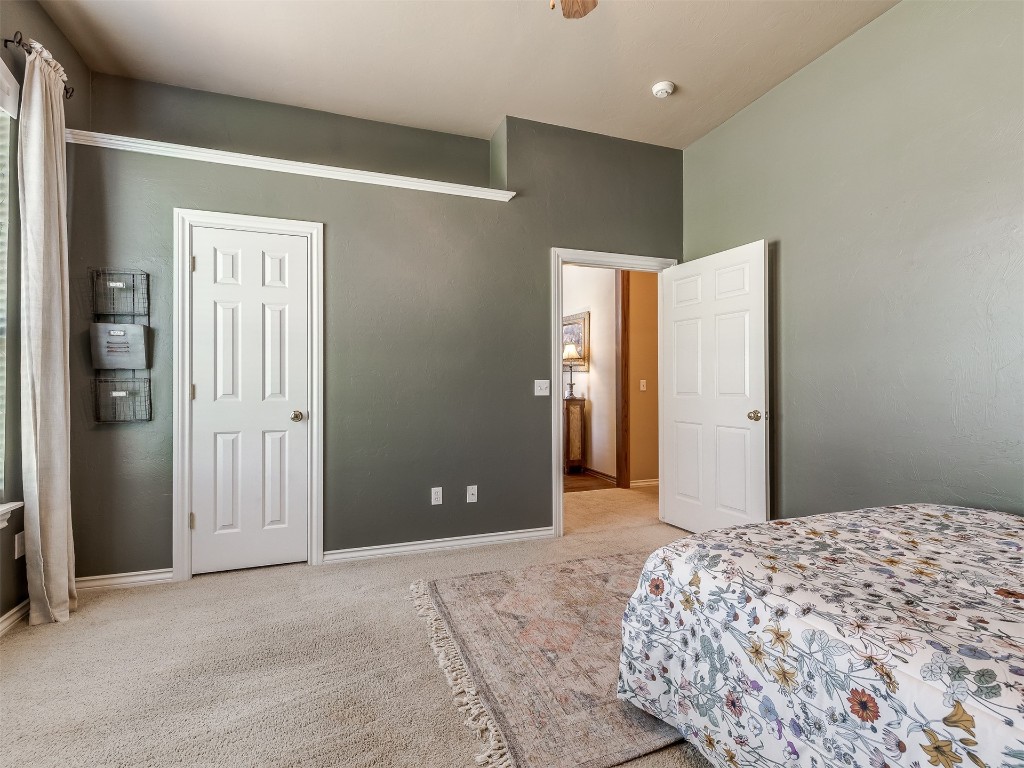 10621 Sundance Avenue, Yukon, OK 73099 bedroom featuring light colored carpet