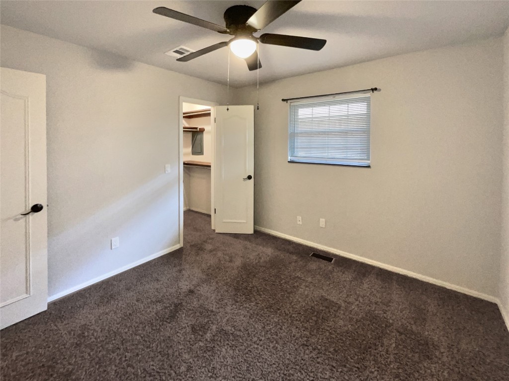 6645 Whitehall Drive, Oklahoma City, OK 73132 carpeted spare room featuring ceiling fan