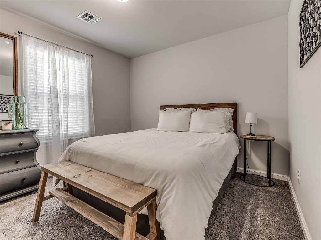 3008 NW 183rd Street, Edmond, OK 73012 view of carpeted bedroom