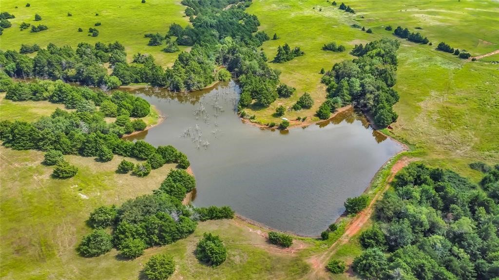 18633 N Santa Fe Avenue, Mulhall, OK 73063 birds eye view of property with a water view