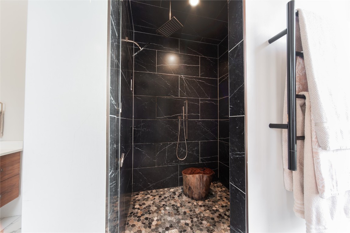 2010 Huntington Avenue, Nichols Hills, OK 73116 bathroom featuring vanity and a tile shower