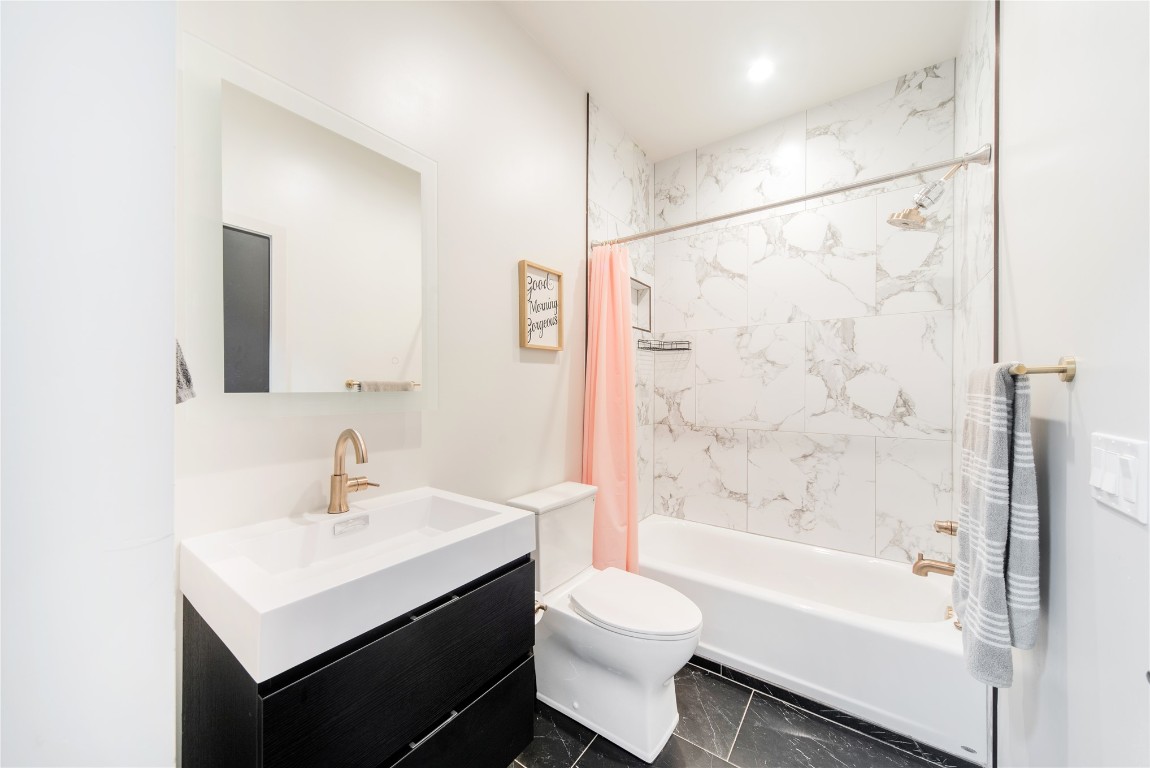 2010 Huntington Avenue, Nichols Hills, OK 73116 full bathroom with toilet, vanity, shower / bath combo, and tile floors