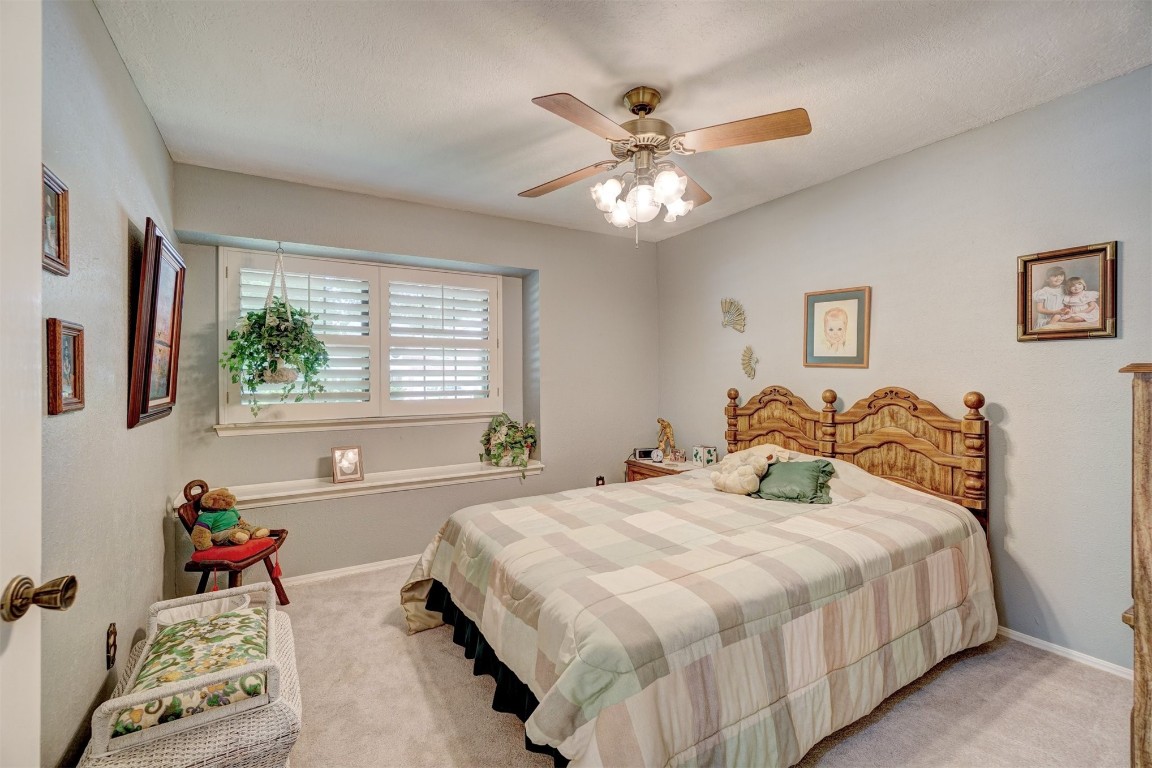 1707 Northcliff Avenue, Norman, OK 73071 bedroom with carpet flooring and ceiling fan