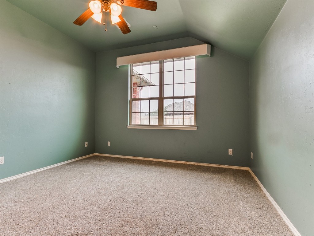 9101 Crooked Creek Lane, Moore, OK 73160 bonus room featuring lofted ceiling, ceiling fan, and carpet floors
