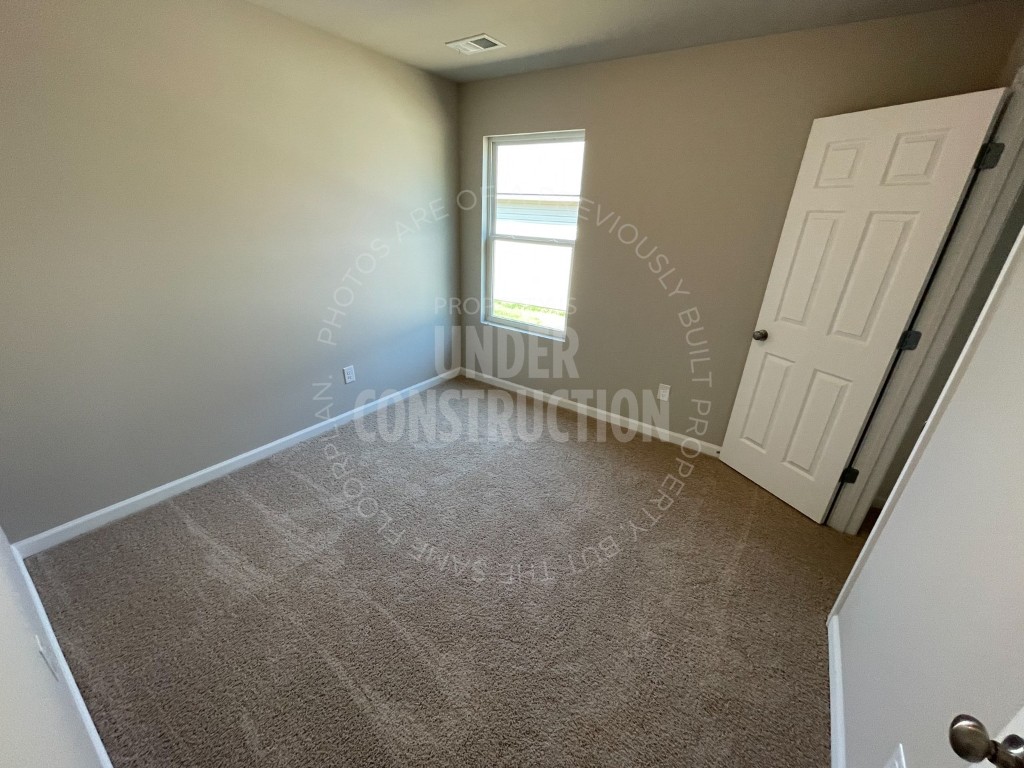 1202 Foal Drive, Guthrie, OK 73044 unfurnished room featuring carpet