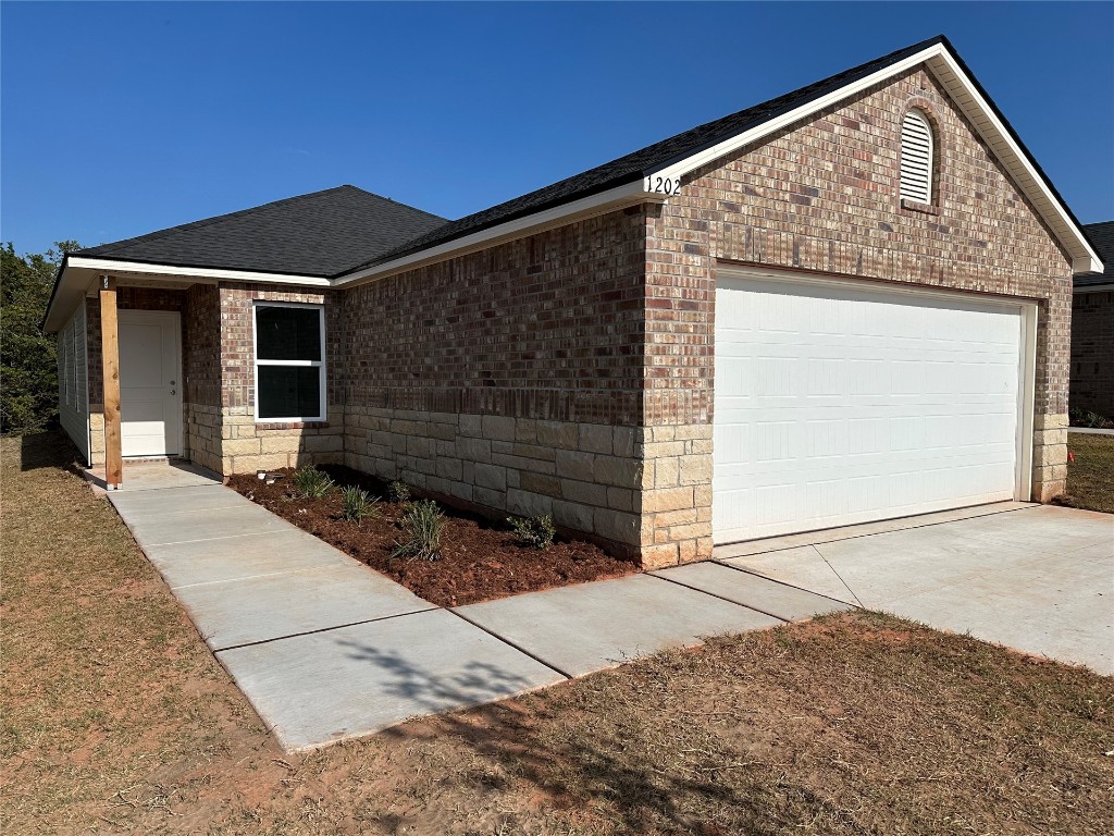 1202 Foal Drive, Guthrie, OK 73044 single story home featuring a garage