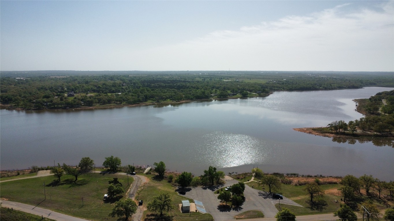 1202 Foal Drive, Guthrie, OK 73044 aerial view featuring a water view