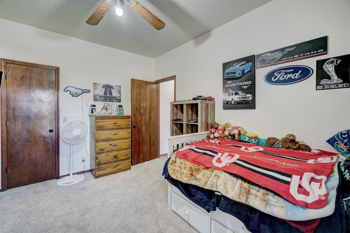 1816 NW 176th Street, Edmond, OK 73012 carpeted bedroom with ceiling fan