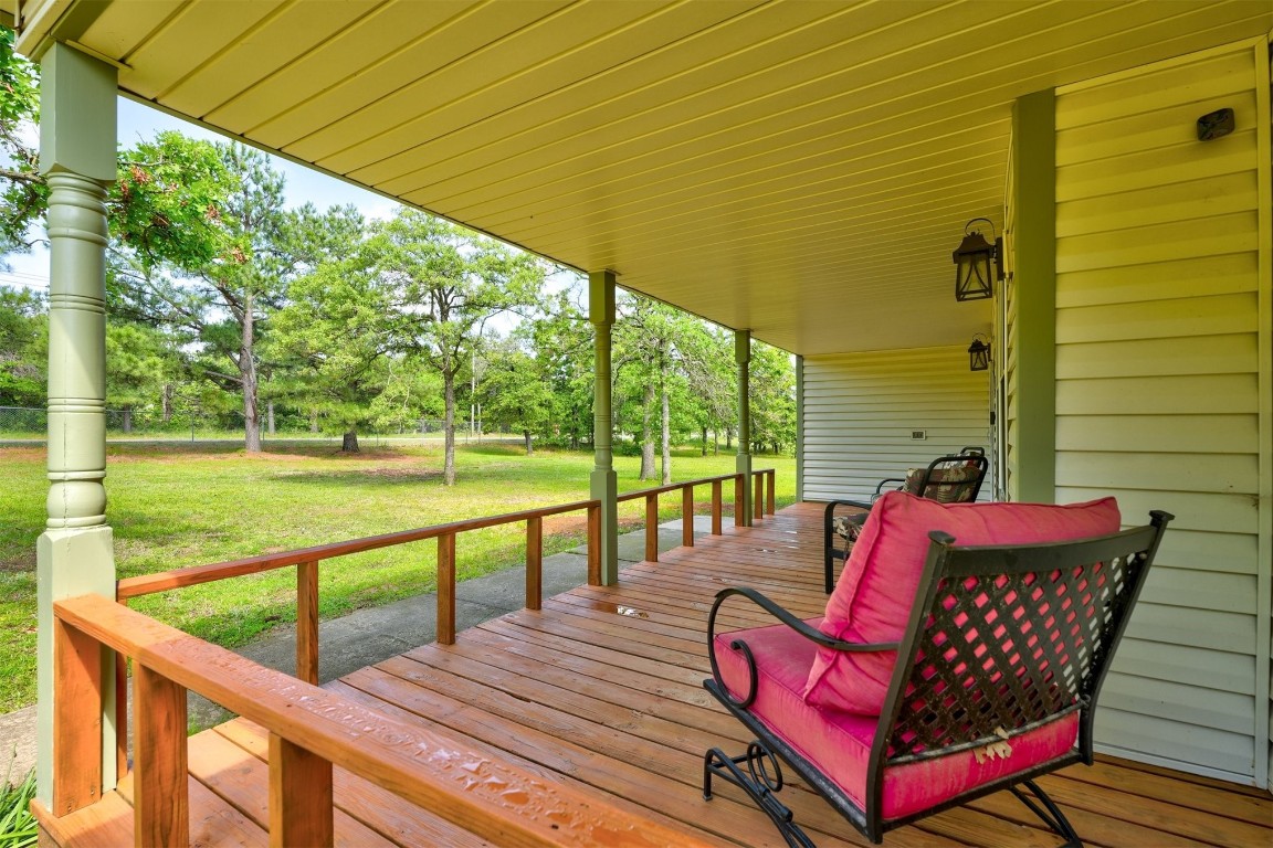 6404 S Peebly Road, Newalla, OK 74857 wooden deck with a yard