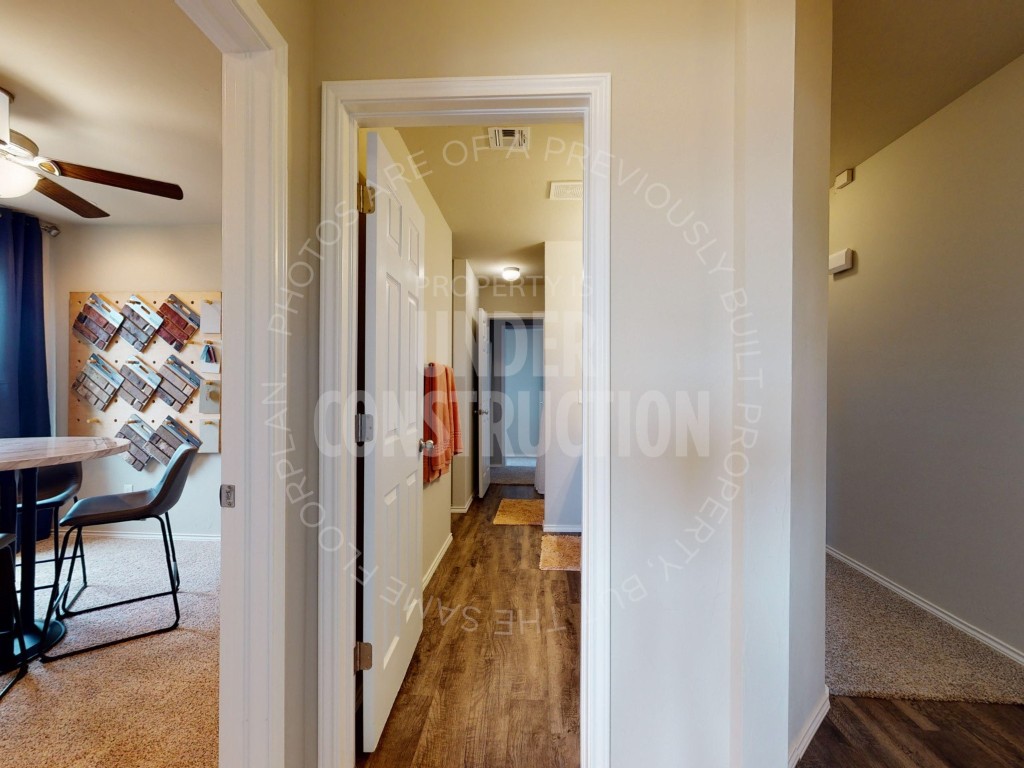10024 SW 41st Street, Mustang, OK 73064 corridor with hardwood / wood-style floors