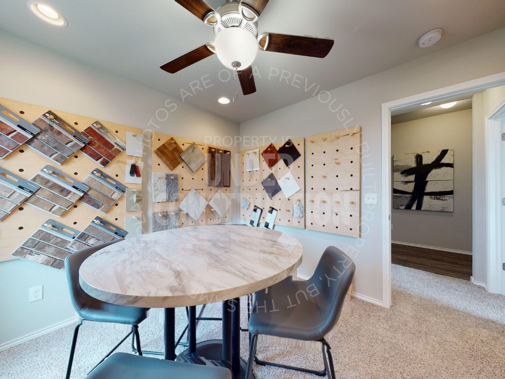 10024 SW 41st Street, Mustang, OK 73064 carpeted dining space featuring ceiling fan