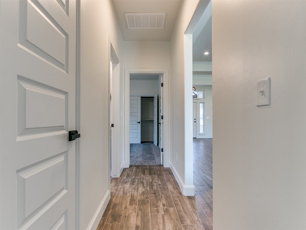 10440 SW 51 Street, Mustang, OK 73064 corridor featuring hardwood / wood-style floors