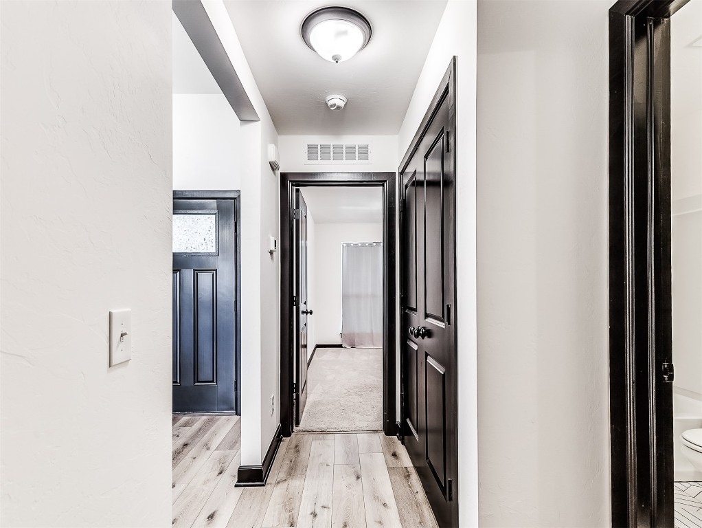 12613 NW 4th Terrace, Yukon, OK 73099 corridor with light wood-type flooring