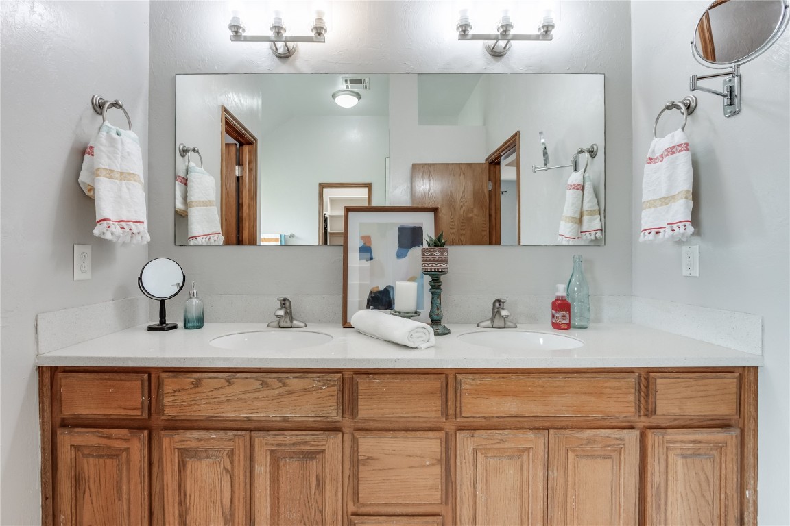 9212 SW 26th Street, Oklahoma City, OK 73128 bathroom featuring dual vanity