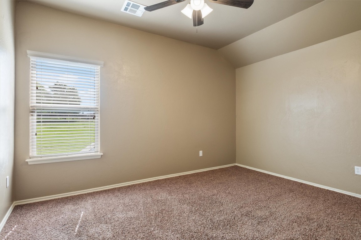 14708 Almond Valley Drive, Oklahoma City, OK 73165 unfurnished room featuring ceiling fan and carpet floors